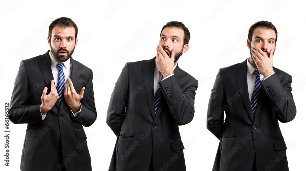 Young businessman surprised over white background Young businessman surprised over white background