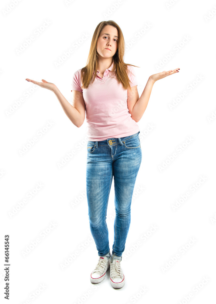 Cute young girl having doubts over isolated white background Cute young girl having doubts over isolated white background