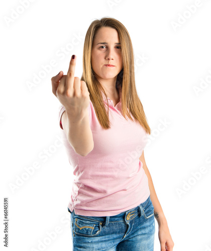 serious girl making horn gesture over white background