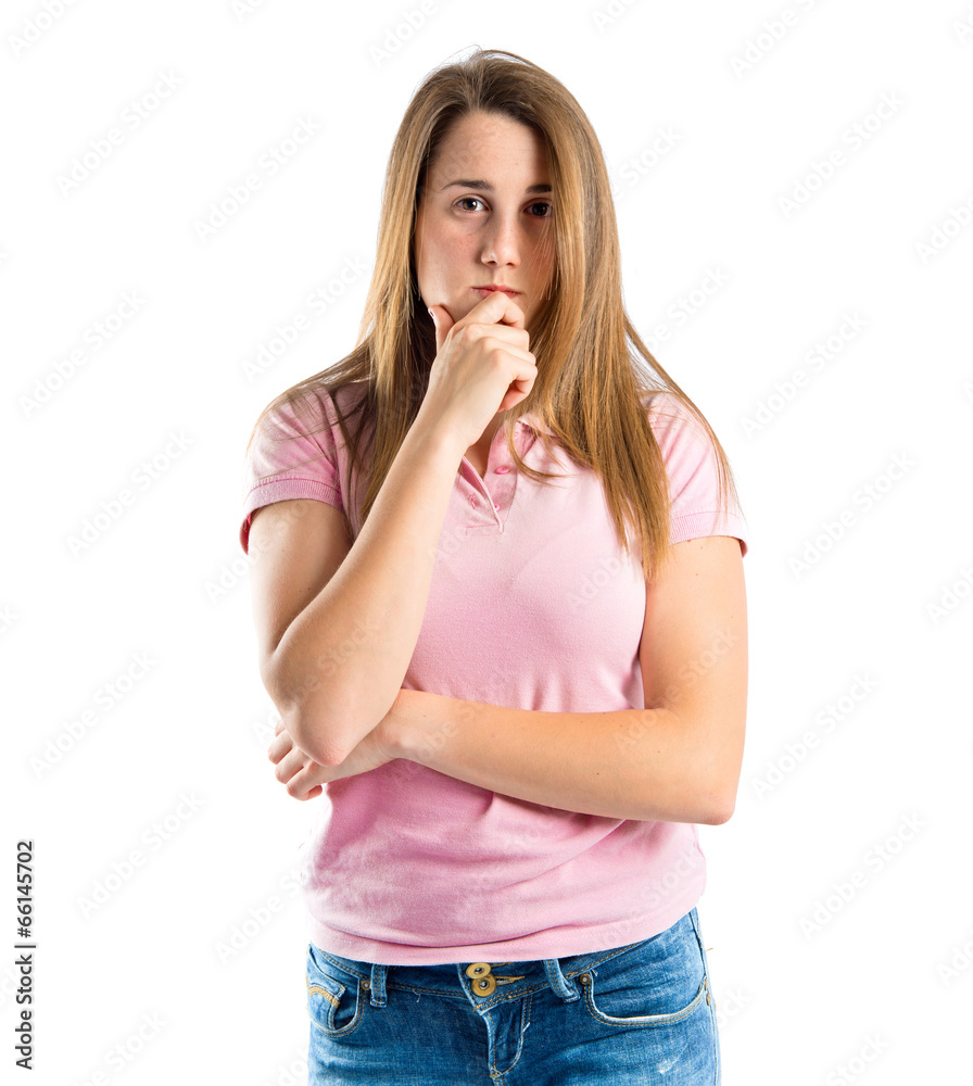Young girl thinking over isolated white background