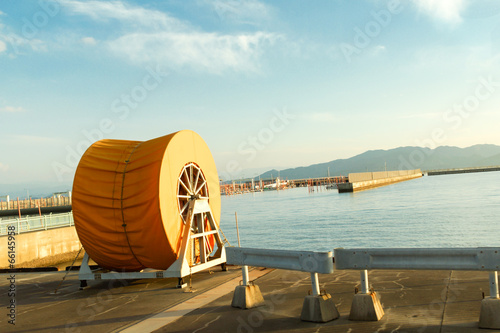 Yellow Oil Spill Boom Reel Nearby the Beach