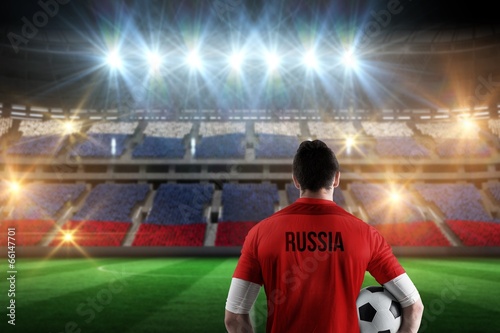 Composite image of russia football player holding ball © WavebreakmediaMicro
