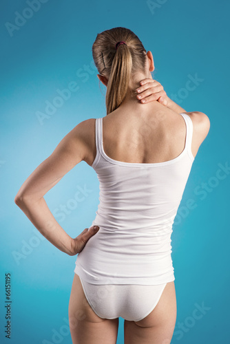 Neck stretch and backache. Woman touching her painfull muscle
