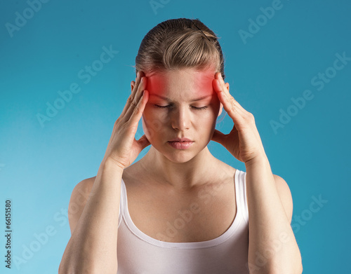 Stressed female having migraine shown with red spots