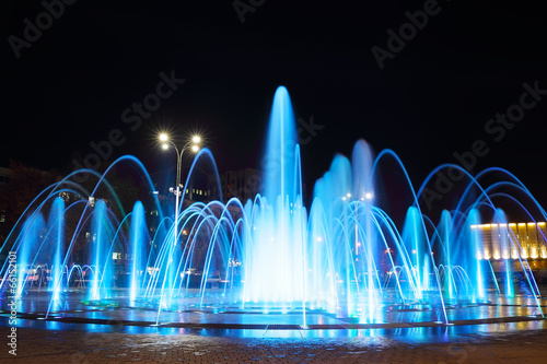 Fountain with colorful illuminations at night