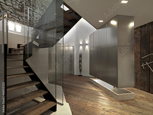 modern entrance with staircase and wood floor