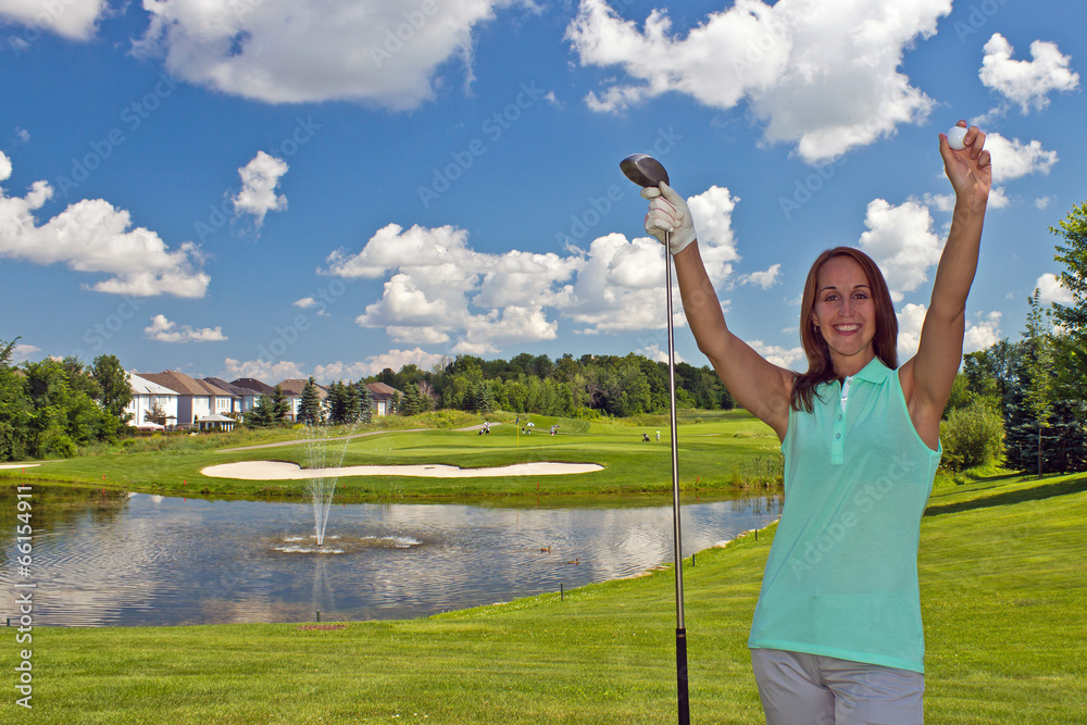 Happy, attractive woman on the golf course Happy, attractive woman on the golf course