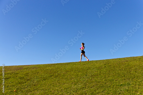 Woman running on a summer day