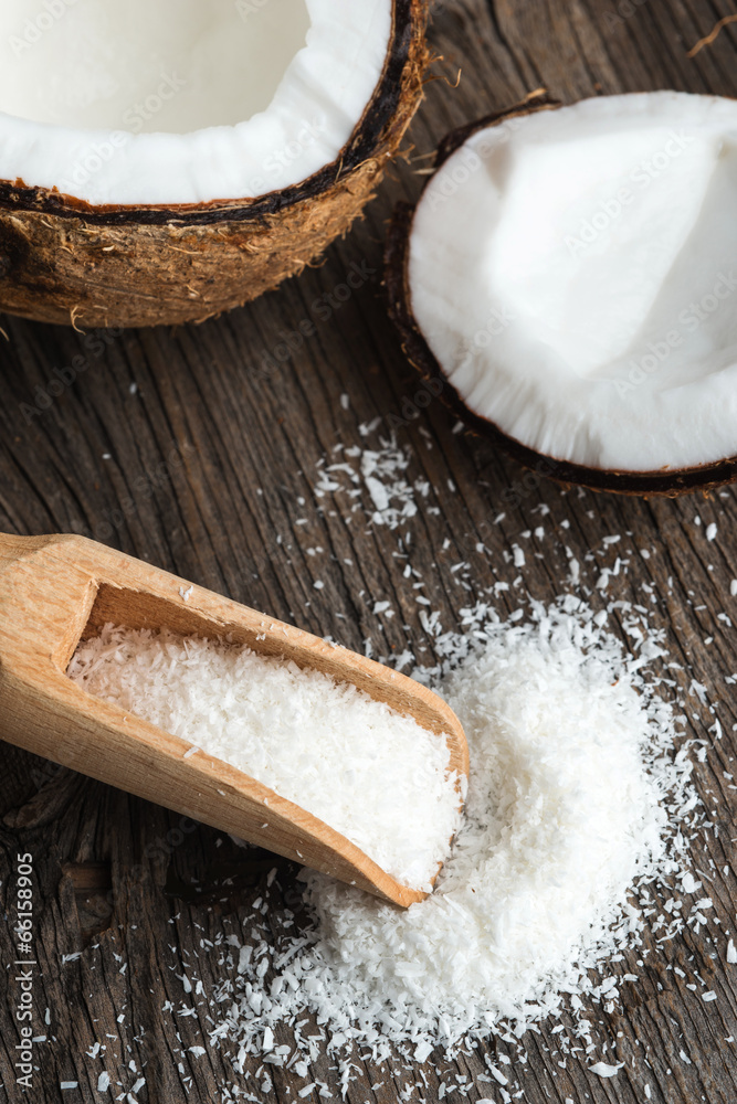 Coconut and grounded coconut flakes on wood Coconut and grounded coconut flakes on wood