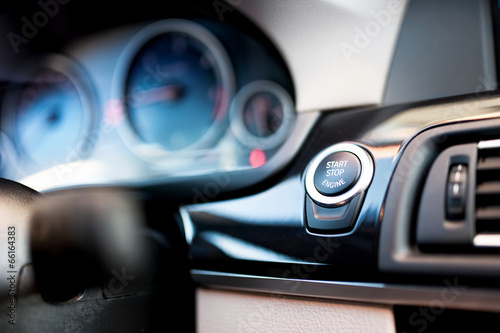 car start and stop button. Modern car interior photo