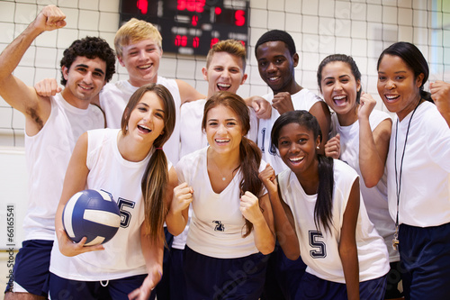 Portrait Of High School Volleyball Team Members With Coach