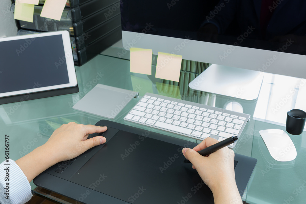 Business woman graphic designer working in office using tablet Business woman graphic designer working in office using tablet