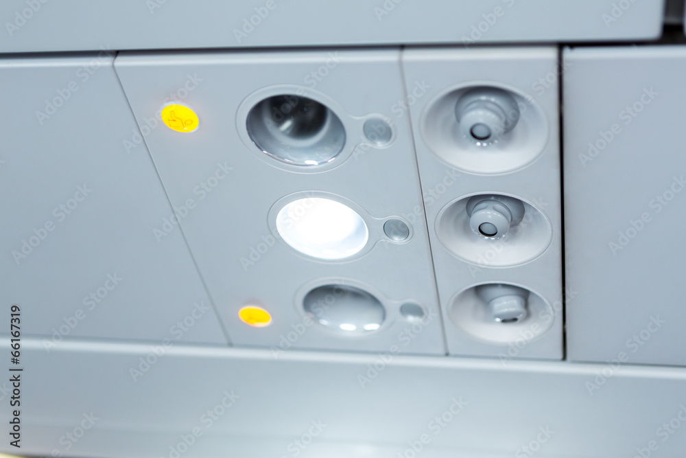 lights, air condition signs panel above the seat on plane lights, air condition signs panel above the seat on plane