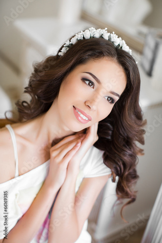Beautiful young bride wedding makeup and hairstyle