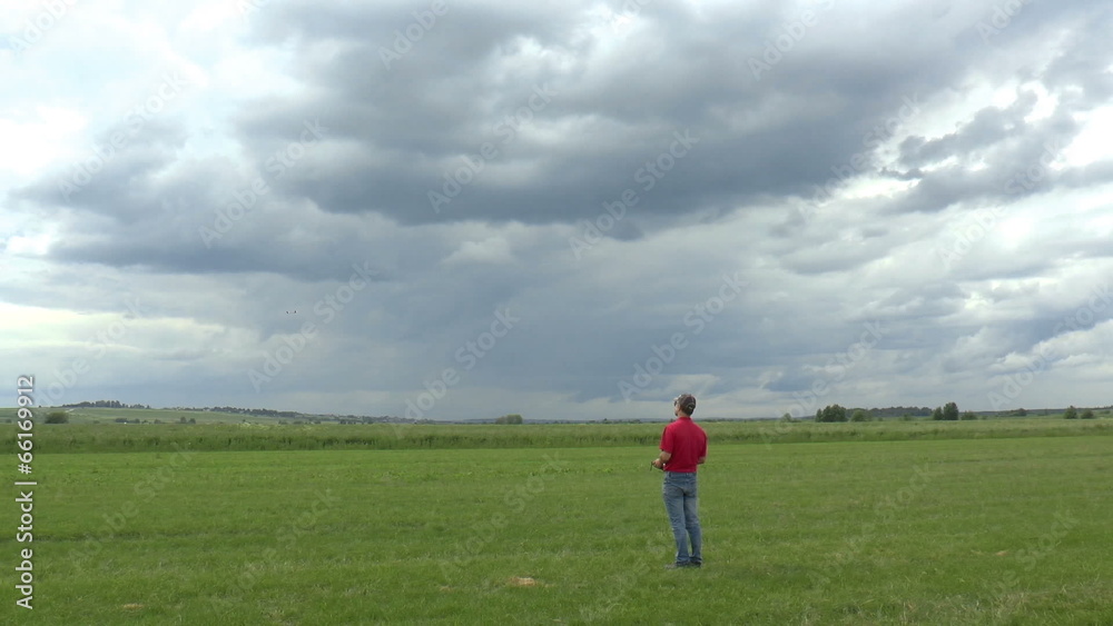 Man Launches RC Glider in the Sky, panoramic view Man Launches RC Glider in the Sky, panoramic view