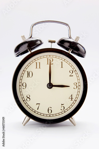 Classic alarm clock at 3 O'clock