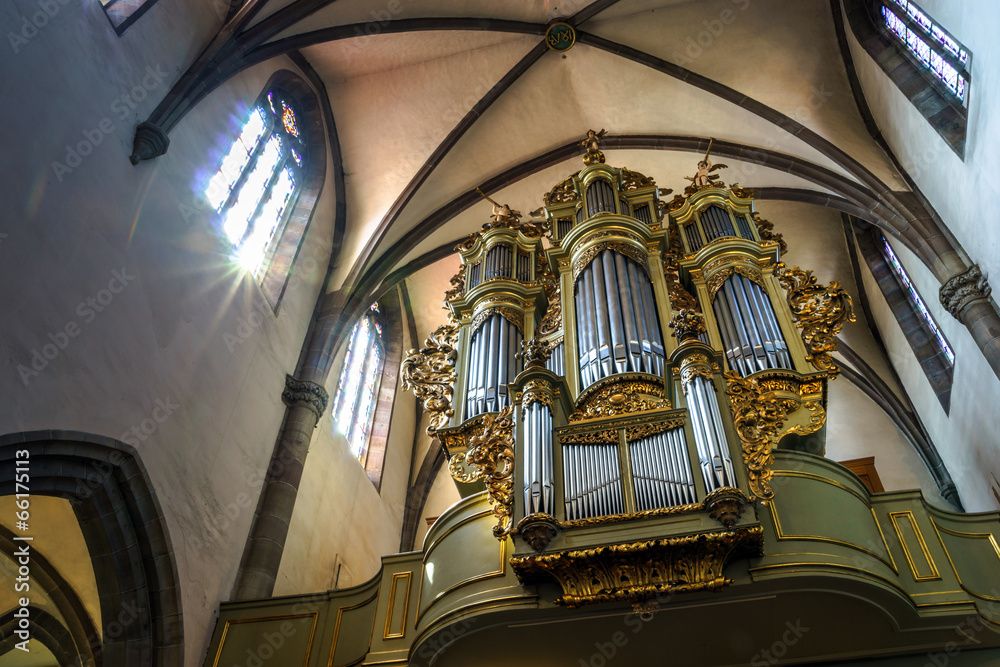 Beautiful old organ decorated by gold