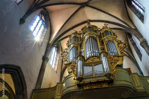 Beautiful old organ decorated by gold