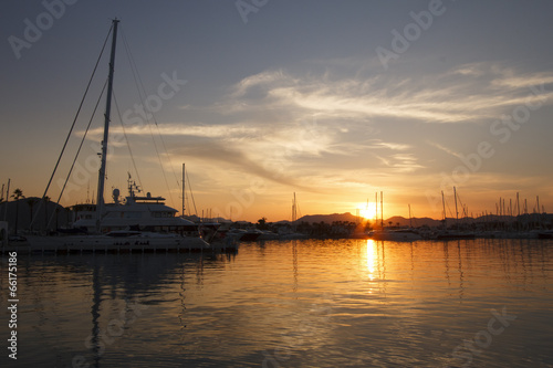 Fototapeta Naklejka Na Ścianę i Meble -  Yachts in harbor at sunset