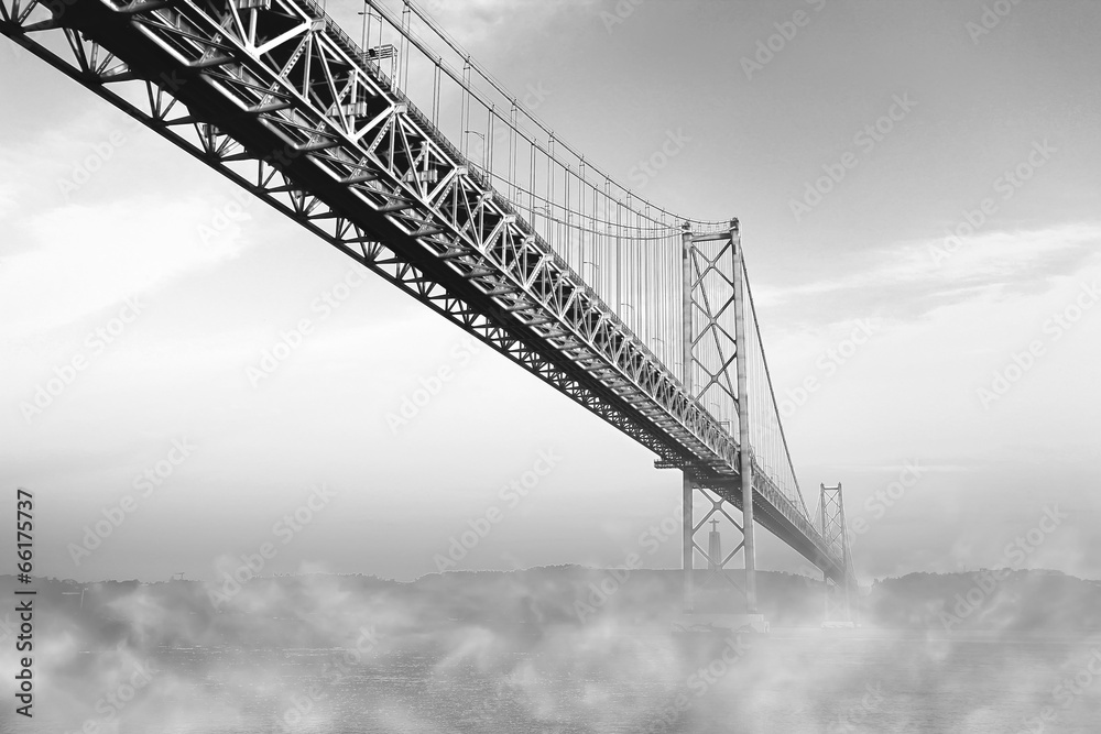 The bridge of April 25 with a fog on a river The bridge of April 25 with a fog on a river