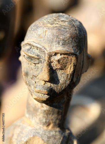 Wooden African mask that represents a woman's face made by hand