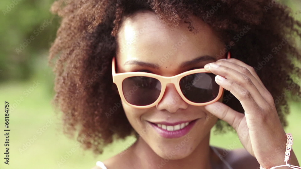 Smiling african american girl looking at camera in slow motion Smiling african american girl looking at camera in slow motion
