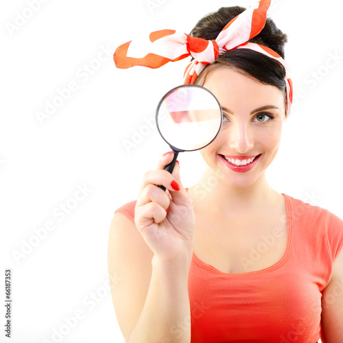 Pinup girl with magnifying glass, portrait of young happy sexy w