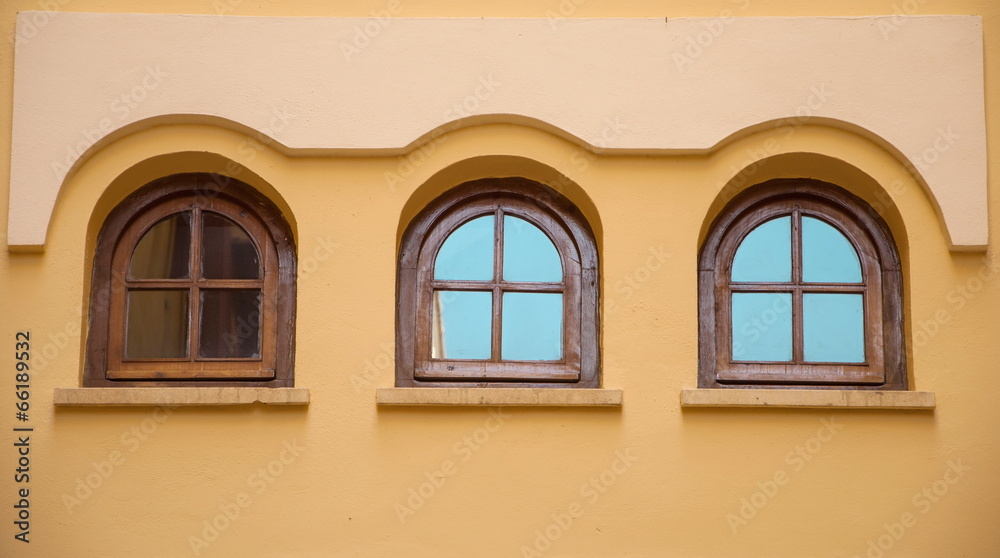 Three windows of a modernist building