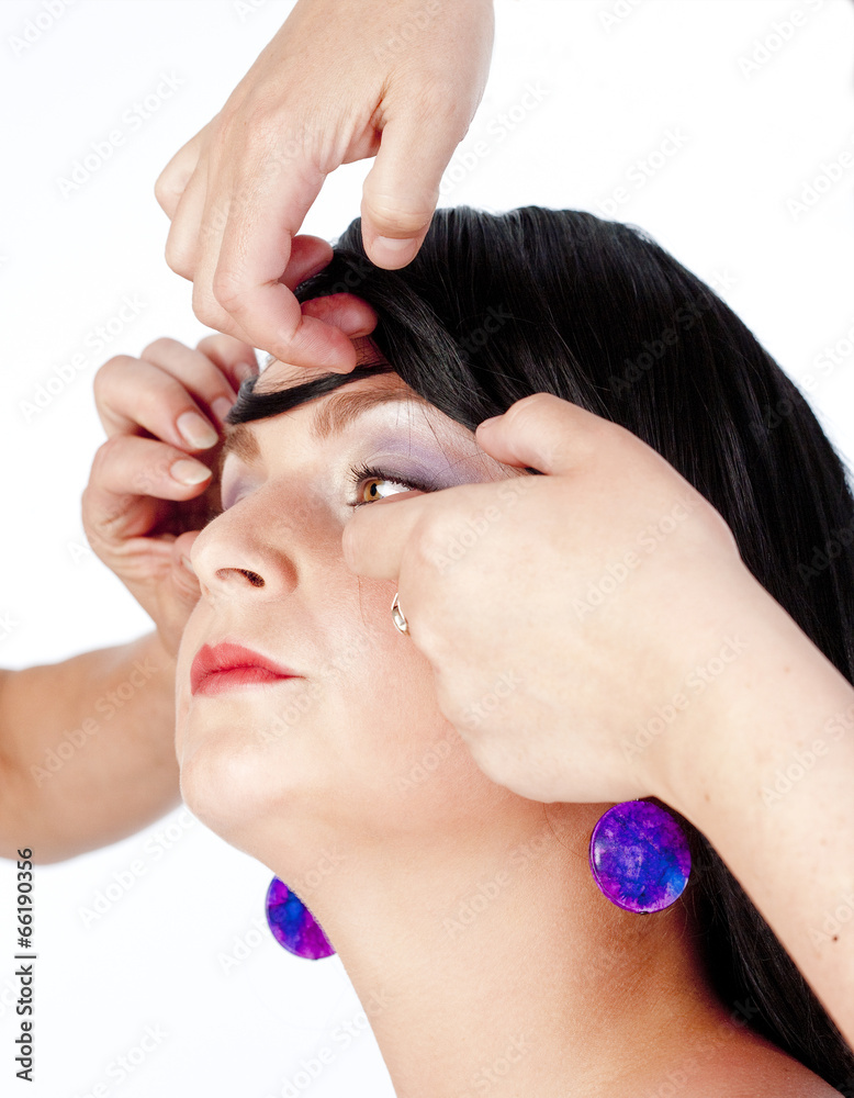 Fototapeta premium Stylists Preparing Model for Photo Shoot