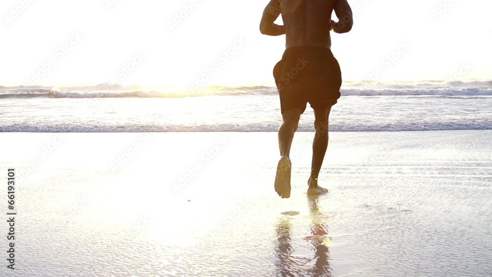 Close up of feet running at the beach