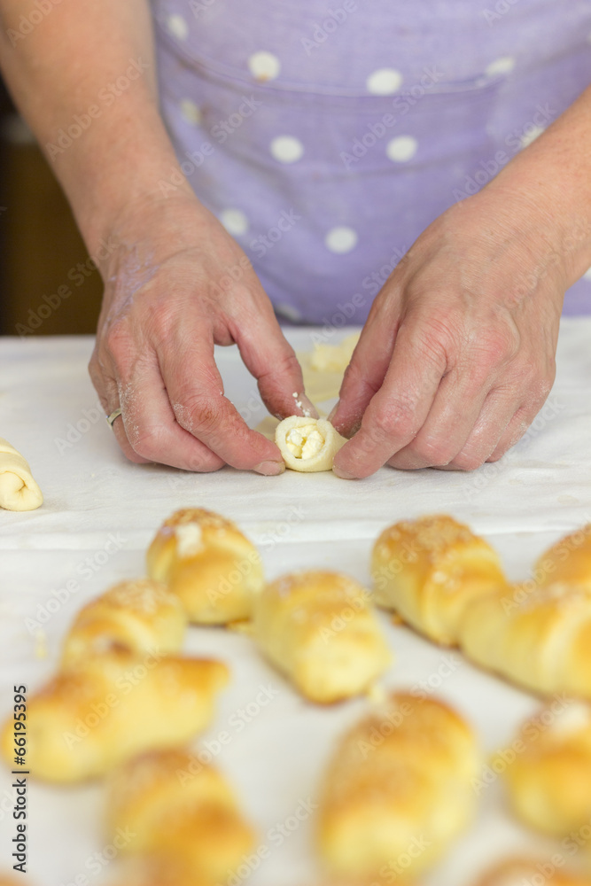 Baker making mini croissants, close up Baker making mini croissants, close up