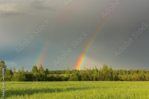 Double rainbow in a sky after storm