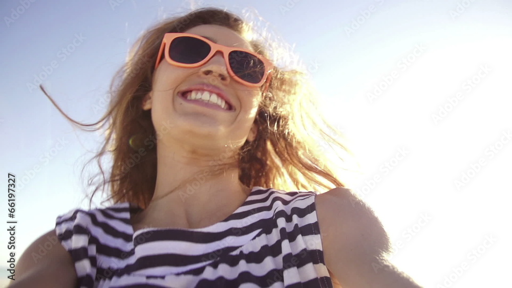 Young woman taking selfie on the beach in slow motion Young woman taking selfie on the beach in slow motion