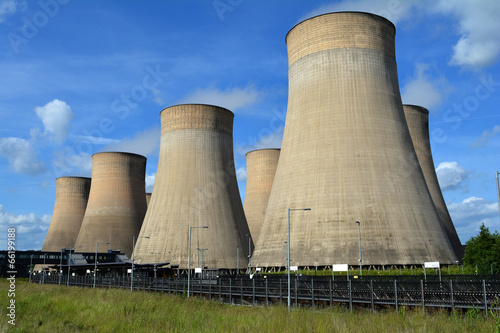 Coal fired power station cooling towers against summer sky