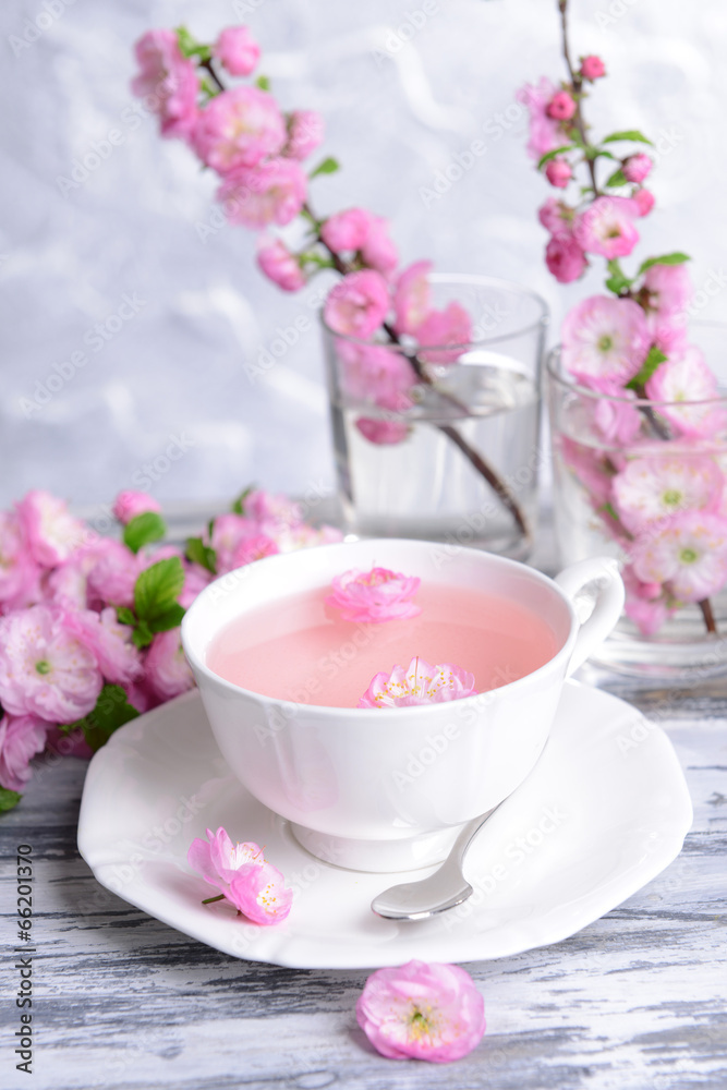 Beautiful fruit blossom with cup of tea Beautiful fruit blossom with cup of tea