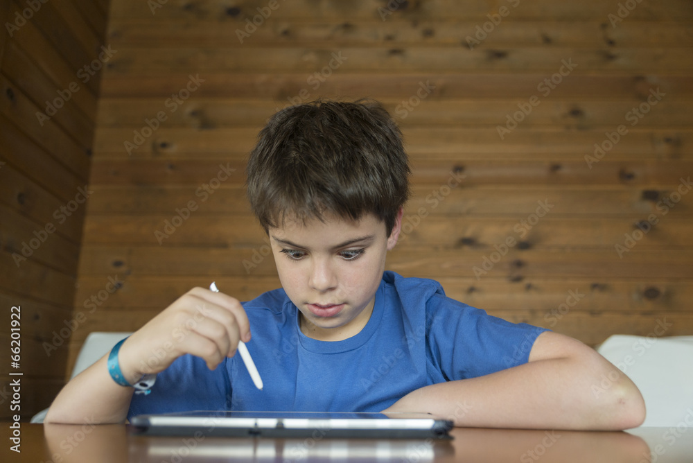 Young boy and a tablet digital Young boy and a tablet digital