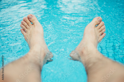 Feet on swimming pool