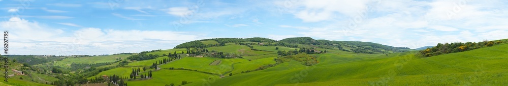 Beautiful panorama of Tuscany with twisting road and cypresses