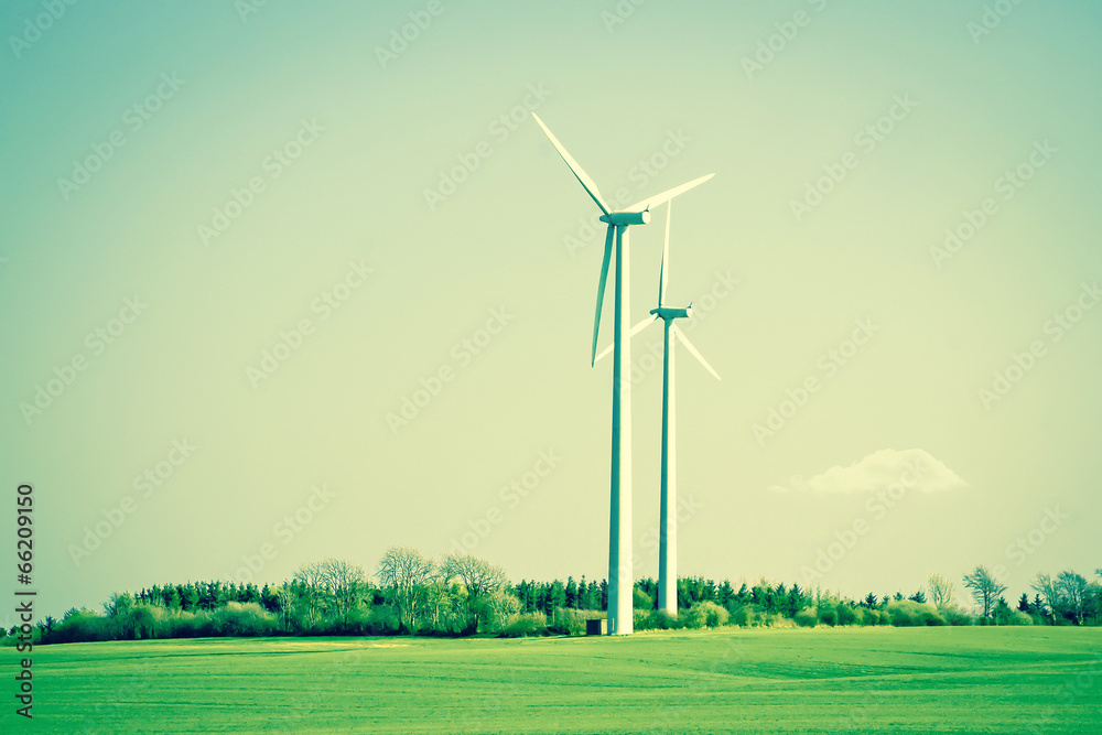 Obraz premium Green energy windmills in beautiful landscape