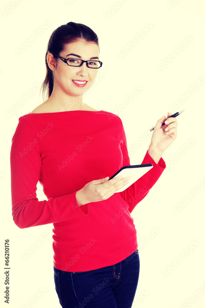 Young pretty woman working on tablet computer Young pretty woman working on tablet computer