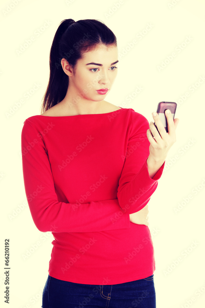 Young woman useing a modern mobile Young woman useing a modern mobile