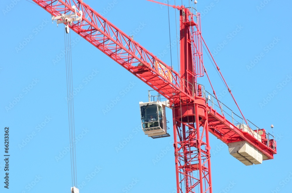 Large red crane with cab