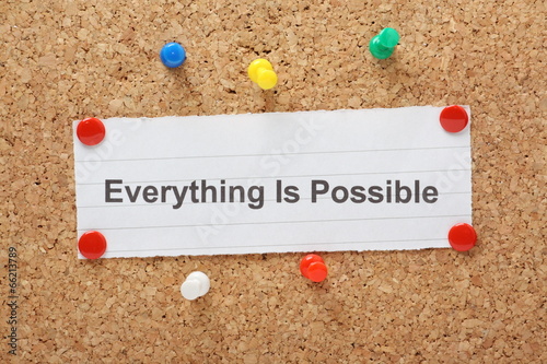 The phrase Everything Is Possible on a cork notice board