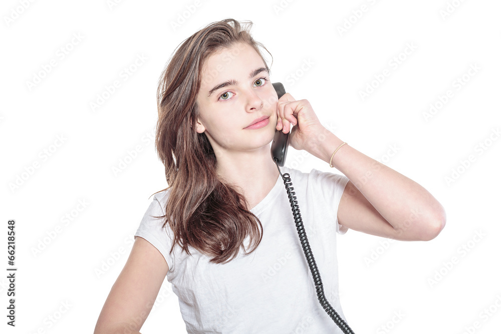 smiling teenager girl talking on the phone, isolated on white