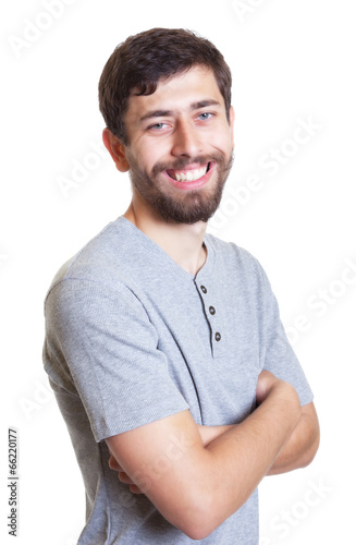Man with beard and crossed arms looking at camera