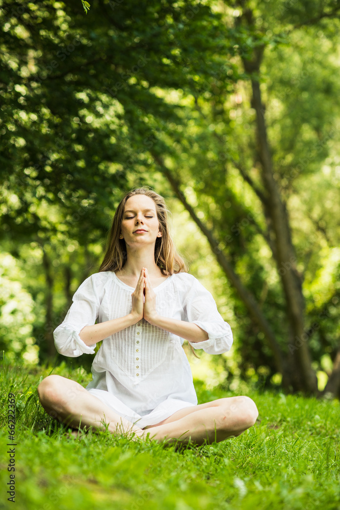 Yoga. Young Woman doing Yoga Exercises Outdoor Yoga. Young Woman doing Yoga Exercises Outdoor