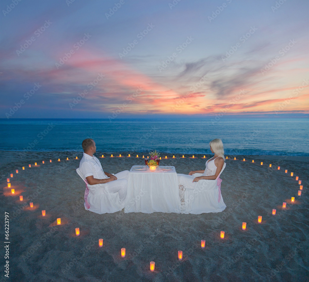 couple at beach romantic dinner with candles heart Stock Photo | Adobe Stock
