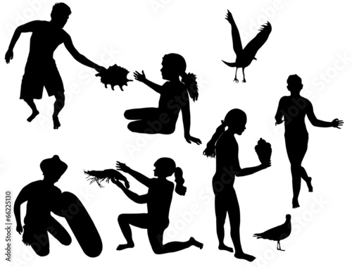 Silhouettes of children playing on the beach