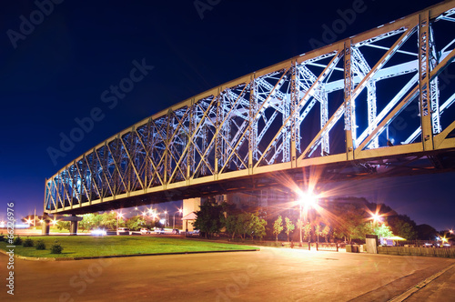Illuminated bridge in the city of Novosibirsk. Uban night landsc