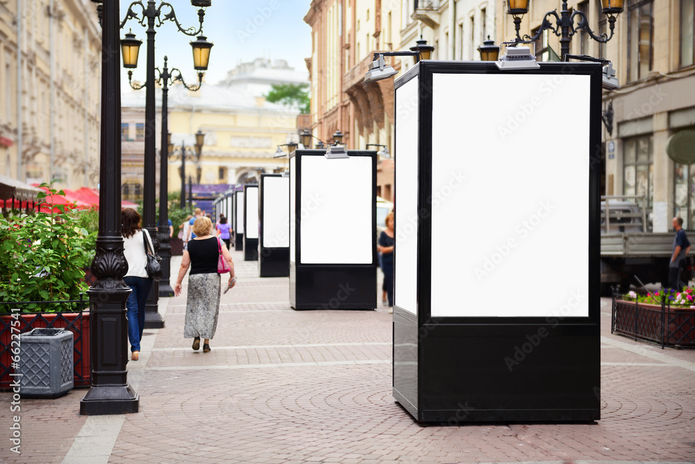 Empty vertical billboard on the street. Focus on board